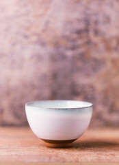 Traditional japanese ceramic on rustic wooden background. Soft focus. Copy space.	