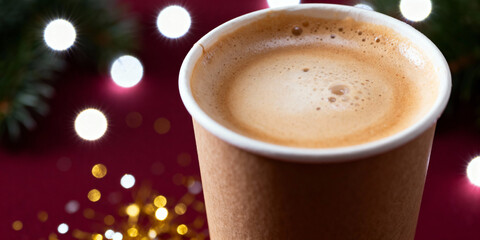 Paper cup of latte with creamy foam on Christmas background