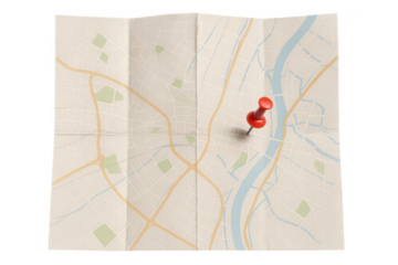 Folded paper map displaying roads, parks, and a river with a red push pin marking a point of interest. Transparent background