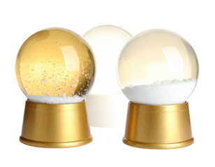 Three decorative globes, two gold-based with snow, one white, positioned against a black backdrop