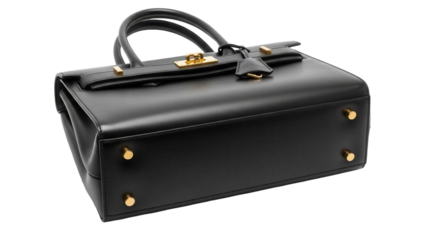 Elegant black leather handbag isolated PNG, luxury fashion accessory for women with golden hardware on transparent background