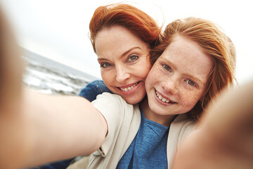 Selfie, mother and girl with smile by beach for vacation, family time and picture for bonding...