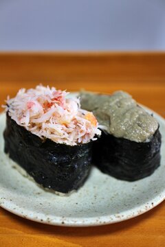 Snow crab and kanimiso (crab tomalley) nigirizushi purchased at a supermarket in Tokyo, Japan