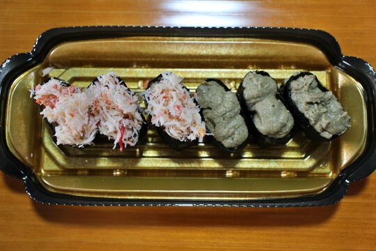 Snow crab and kanimiso (crab tomalley) nigirizushi purchased at a supermarket in Tokyo, Japan