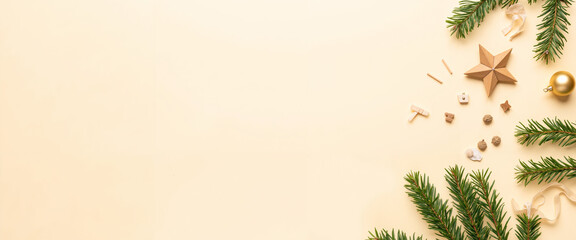 Festive Christmas decorations with pine branches and ornaments on beige background  