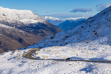The Crown Range between Queenstown and Wanaka in the South Island of New Zealand, covered in winter snow