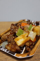 Black vinegar subuta (sweet and sour pork) purchased at a supermarket in Tokyo, Japan