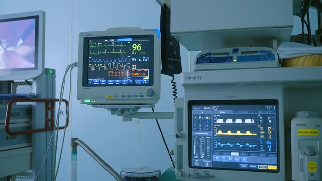 Medical monitors display vital signs, heart rate, blood pressure and ventilation parameterю Patient monitoring and anesthesia equipment in operating room,  vital signs display, hospital technology 