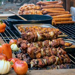 Stack of Grilled Pork Shashlik and Sausages at Winter Christmas Market Stall