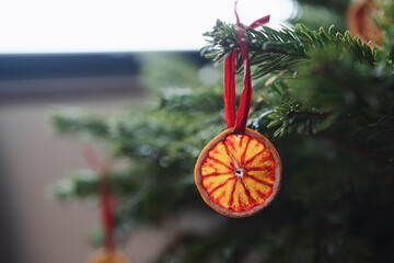 Closeup small christmas tree with dried oranges as decorations for holidays