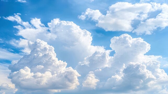 Azure Canvas: A picturesque view of the sky, with fluffy, white cumulus clouds set against a bright, clear blue backdrop, creating a serene and uplifting scene.