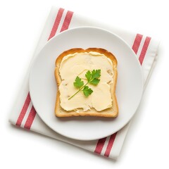 Slice of toast with butter and parsley on a plate
