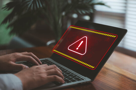 Laptop screen red warning alert. concept of cyber scam, risk of digital, system error, online security issues, technology vulnerability. Danger warning sign for a hacker attack, data system failure