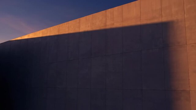 Cinematic time lapse of long, dark shadows moving rhythmically across the smooth, blank wall of a monolithic modern building facade during the golden hour transition, facade, light