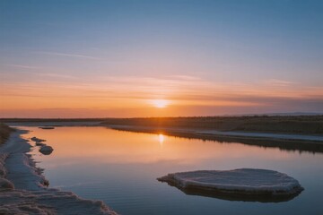 Fototapeta premium Sunset over a calm river with ice formations reflecting golden light