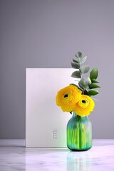 Yellow Ranunculus Flowers in Vase with White Box
