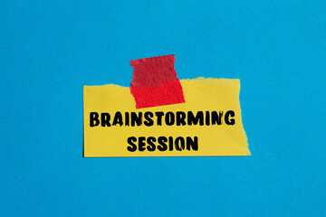 Brainstorming session message written on ripped torn paper background. Conceptual Brainstorming session symbol. Copy space.