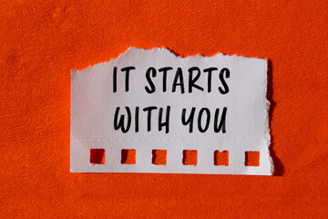It starts with you message written on ripped torn paper background. Conceptual It starts with you symbol. Copy space.