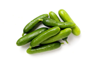 Fresh mini baby cucumbers on white background