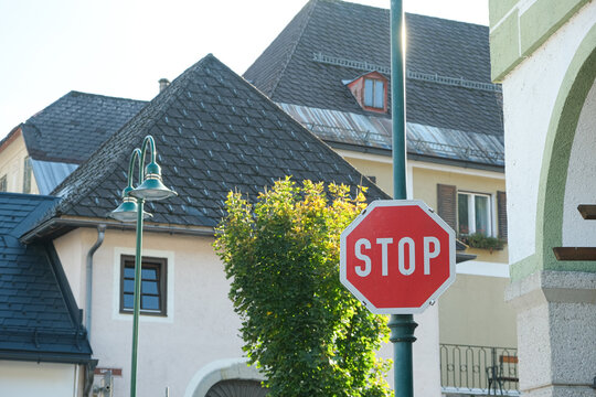 Red Octagonal STOP Sign on a Street Post - Powered by Adobe