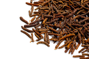 Long pepper (Piper longum), a spice used in traditional medicine and cooking, known for its pungent flavor.