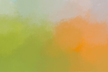 Soft abstract background texture with blended colors of orange green and pale blue