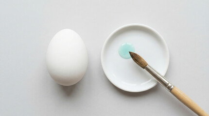 Creative egg decorating activity for Easter celebration with brush and paint