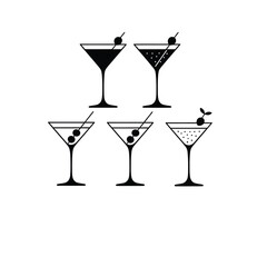 Collection of five martini glasses with garnishes