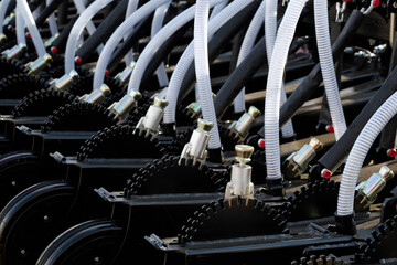 Automatic control and pneumatic tubes for grain feeding system for large volumes of grain.