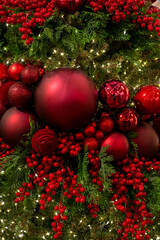 Festive Red Christmas Ornaments on Holiday Wreath