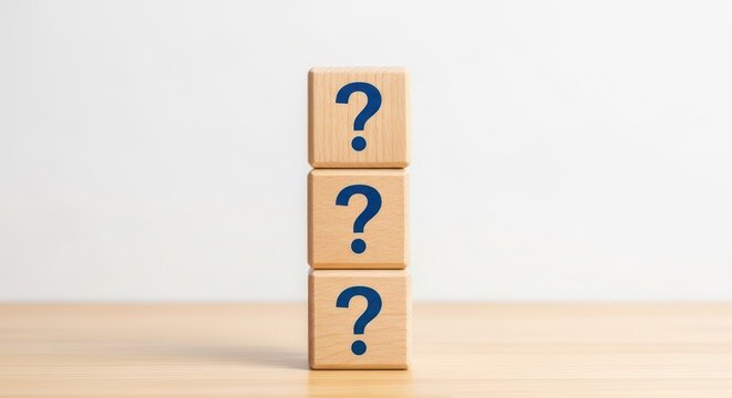 Three wooden blocks stacked vertically with question marks. - Powered by Adobe