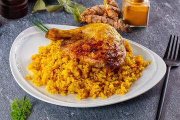 Roasted chicken leg with yellow rice