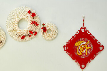 Vietnamese Tet Wall Decoration with Red and Gold Hanging Ornament and White Yarn Wreaths