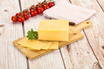 Yellow cheese piece with slices