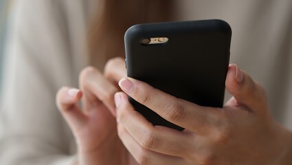 Person Using Black Mobile Phone Case for Device Protection While Texting and Holding Modern Smartphone for Communication and Connection Demonstrating Mobile Lifestyle