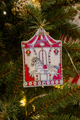 Festive Carousel Ornament Hanging on Christmas Tree