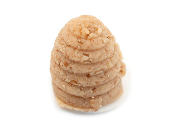 Traditional Silesian bee-hive shaped cookies made from ground nuts on a clean white background, regional Polish dessert prepared for holidays and local culinary culture