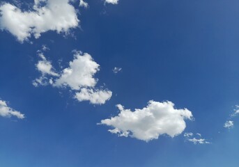 ​Bright Blue Sky with Fluffy White Cumulus Clouds on a Sunny Day