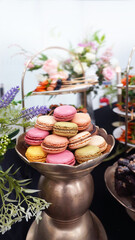 Elegant hotel dessert corner featuring colorful macarons and gourmet pastries