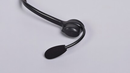 A closeup of a microphone from a headset isolated on white background
