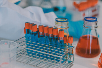 Portrait, science and happy woman on laptop in lab to research chemistry, test or innovation. Microscope, scientist and face of medical doctor in goggles for microbiology, healthcare or pharma study