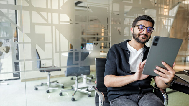 Man using tablet in modern office setting