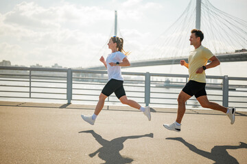 Runners enjoy exercise along city waterfront path
