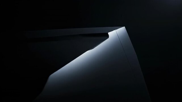 Slow cinematic tracking shot across the immense, smooth surface of a colossal, monolithic structure in complete, dark shadow darkness, darkshadow, monolithic