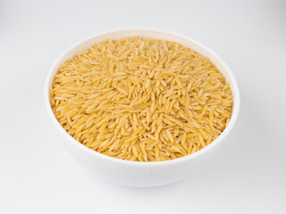 Raw orzo pasta, risoni or kritharaki pile