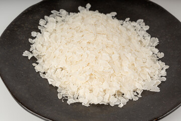 Raw flattened rice. Dry rice flakes or poha, Indian breakfast food
