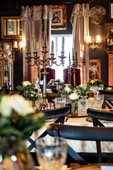 Elegant Vintage Dining Room with Candelabras and Floral Centerpieces