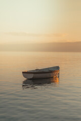 Small boat on a calm lake © Adam Rhodes