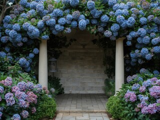 Lush blue and purple hydrangeas frame a stone archway and walkway in a tranquil garden