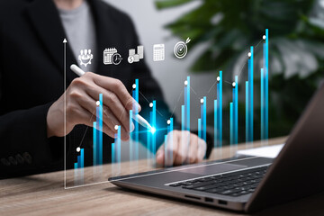 Business Growth Concept, Businesswoman Using Tablet to Compare Business and Financial Growth Charts, Forecasting Next-Year Market and Investment Performance to Achieve Target Goals and Cost Reduction